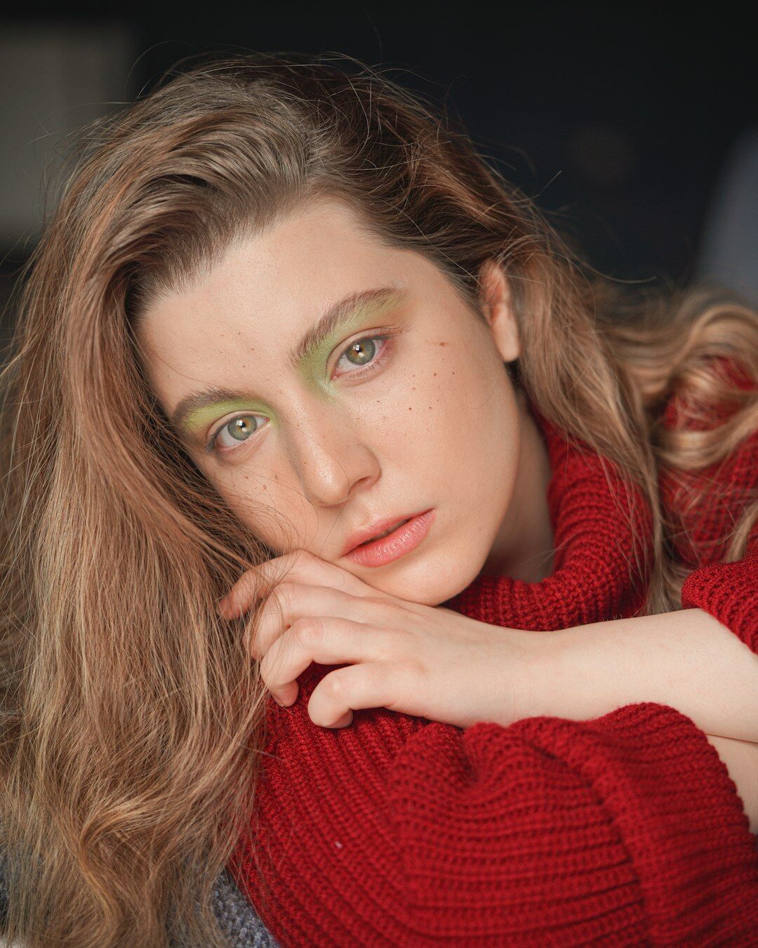 Portrait of a Danish female documentary photographer holding a camera
